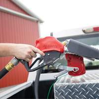 Pistolet de distribution automatique rouge pour essence Distribution Jean Lapalme